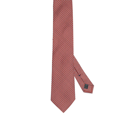 Cravatta in seta italiana al 100% rosso ruggine con motivo micro geometrico blu