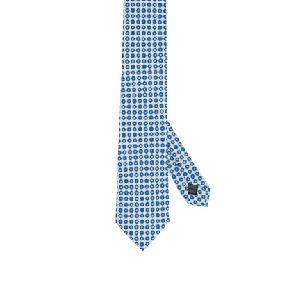 Cravatta in seta italiana al 100% celeste con motivo floreale micro blu