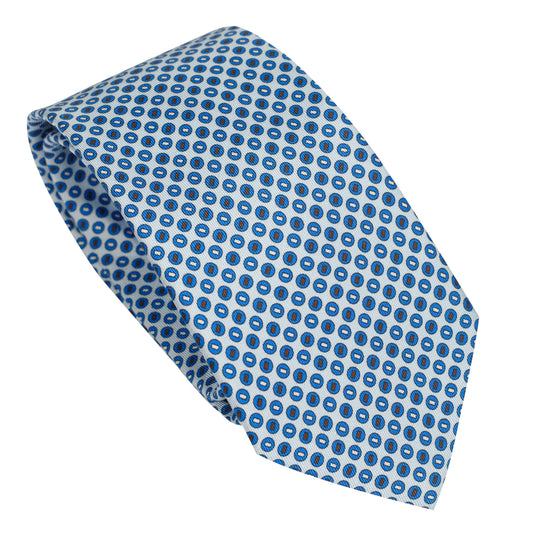 Cravatta in seta italiana al 100% azzurra con motivo circolare blu