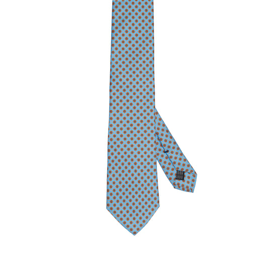Cravatta in seta italiana al 100% celeste con motivo micro arancione bruciato