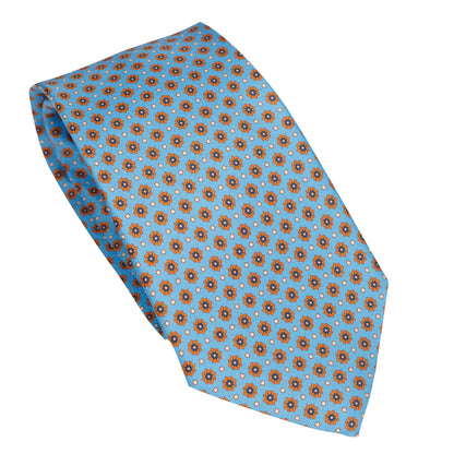 Cravatta in seta italiana al 100% celeste con motivo micro arancione bruciato