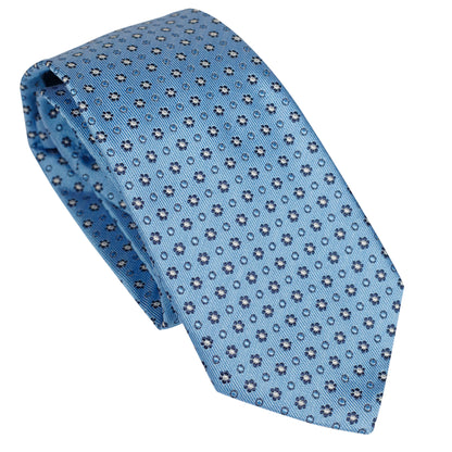 Cravatta in seta italiana al 100% azzurra con motivo floreale micro blu