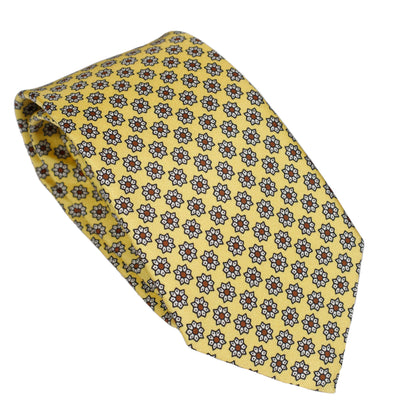 Cravatta in pura seta italiana al 100% giallo intenso con motivo a micro medaglioni blu e bordeaux