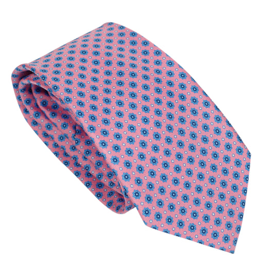 Cravatta in pura seta italiana al 100% color rosa carbone con motivo floreale blu